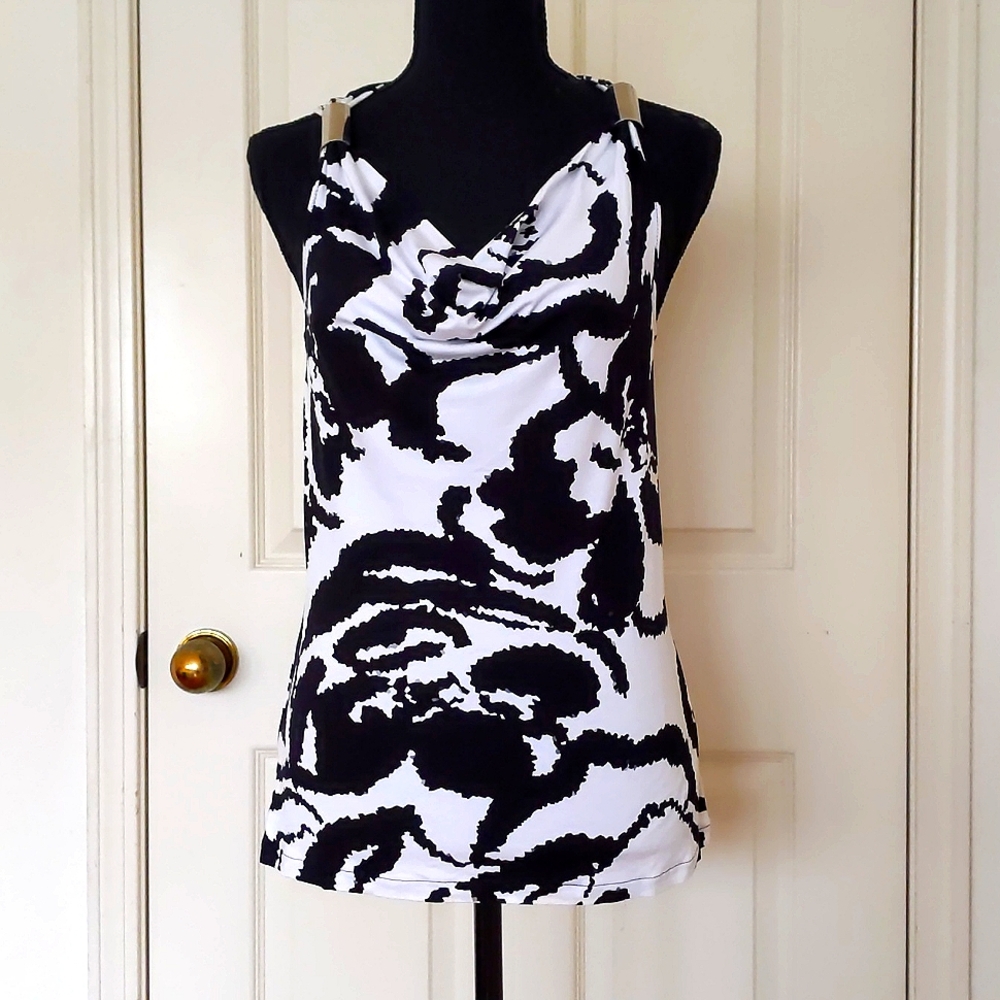 NWT. Express Rayon Spandex Black/White Patterned Sleeveless Top w/metal decor.